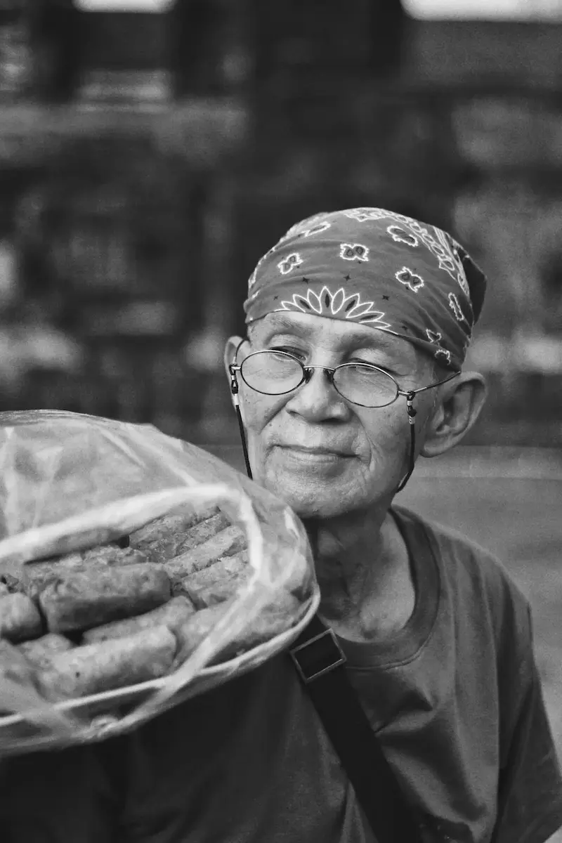 Old man selling snacks