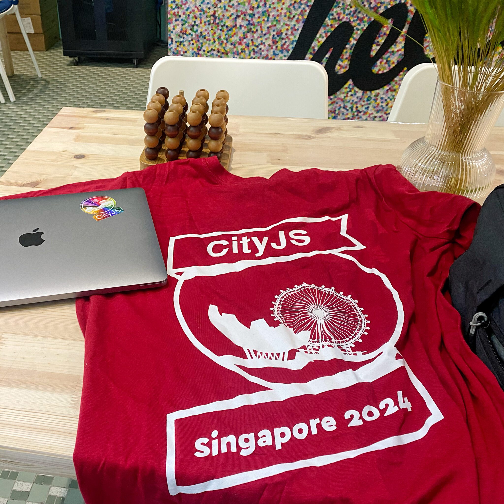 CityJS T-shirt and a CityJS Sticker that I have put on my laptop.